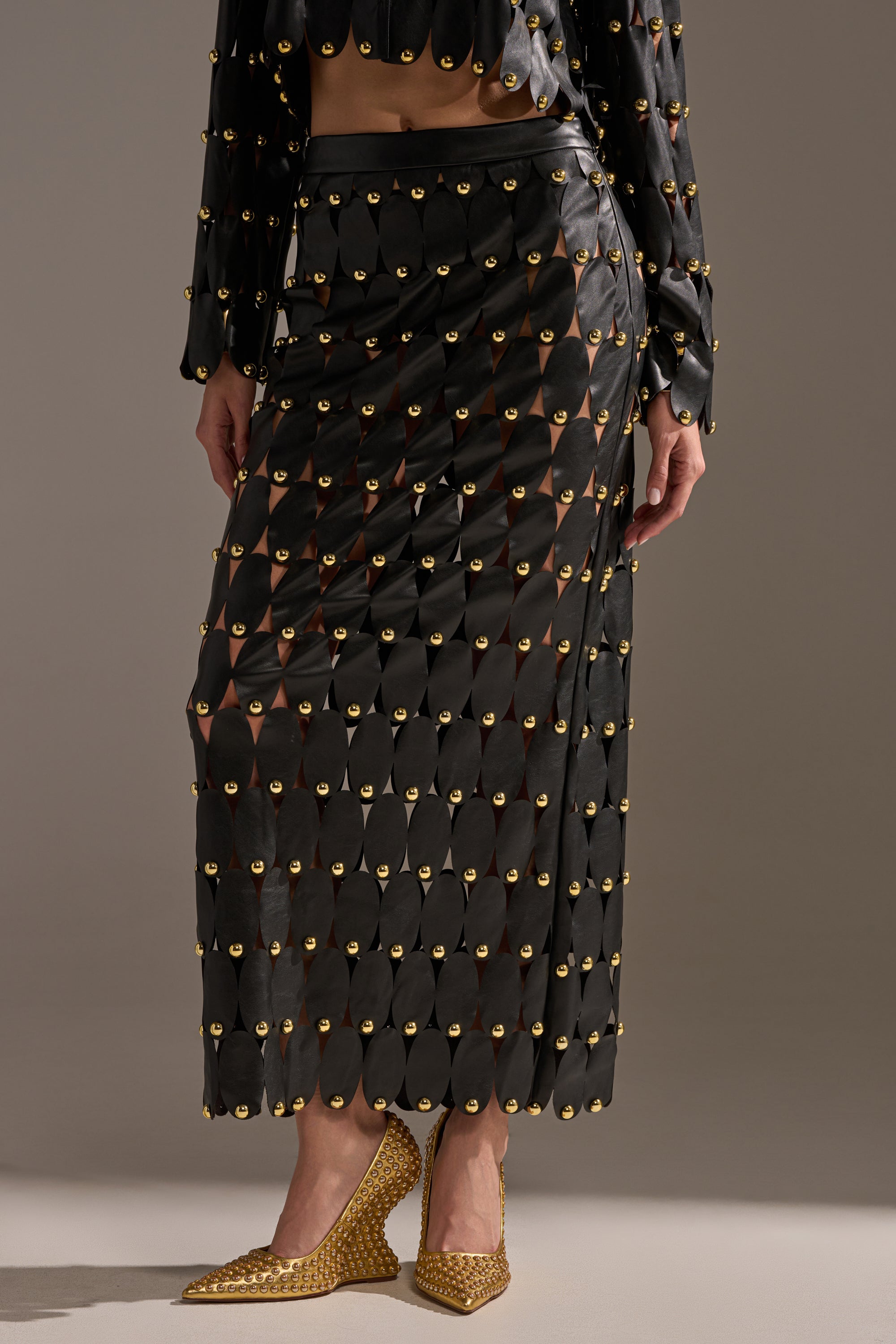 THE SNEAK PEEK STUDDED PU MIDI SKIRT IN BLACK