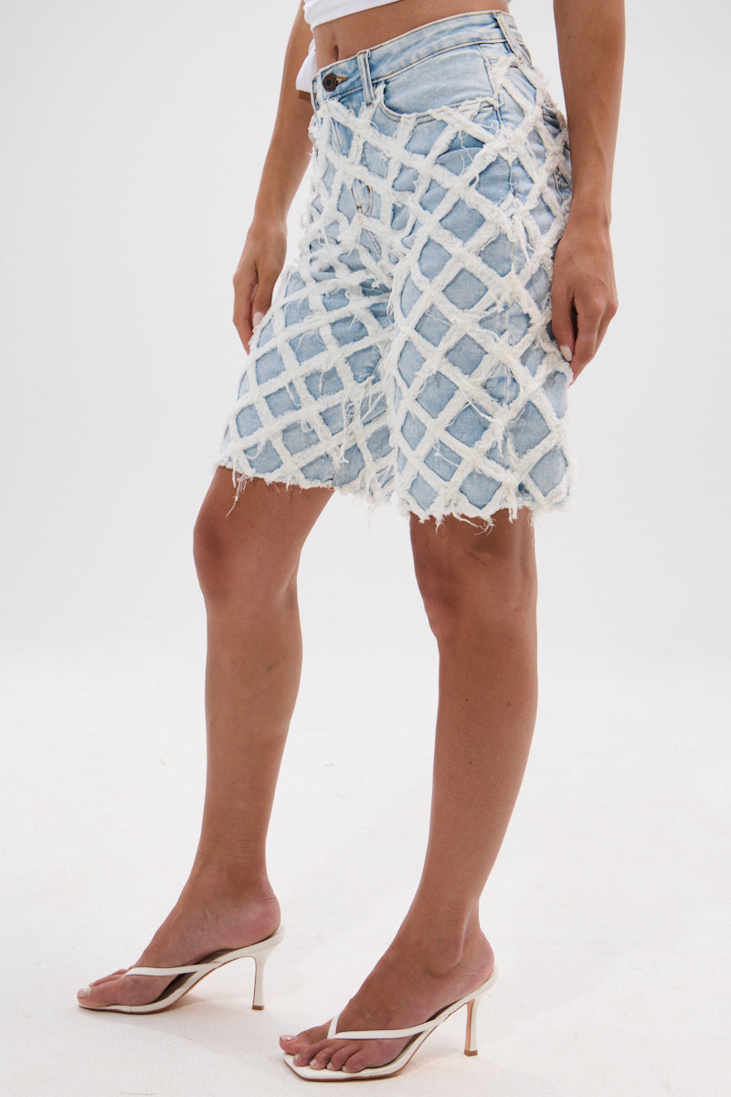 DISTRESSED AND STRESSED DENIM BERMUDA SHORT