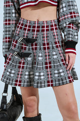 ALL EYES ON ME BUCKLE DETAIL KNIT MINI SKIRT IN RED