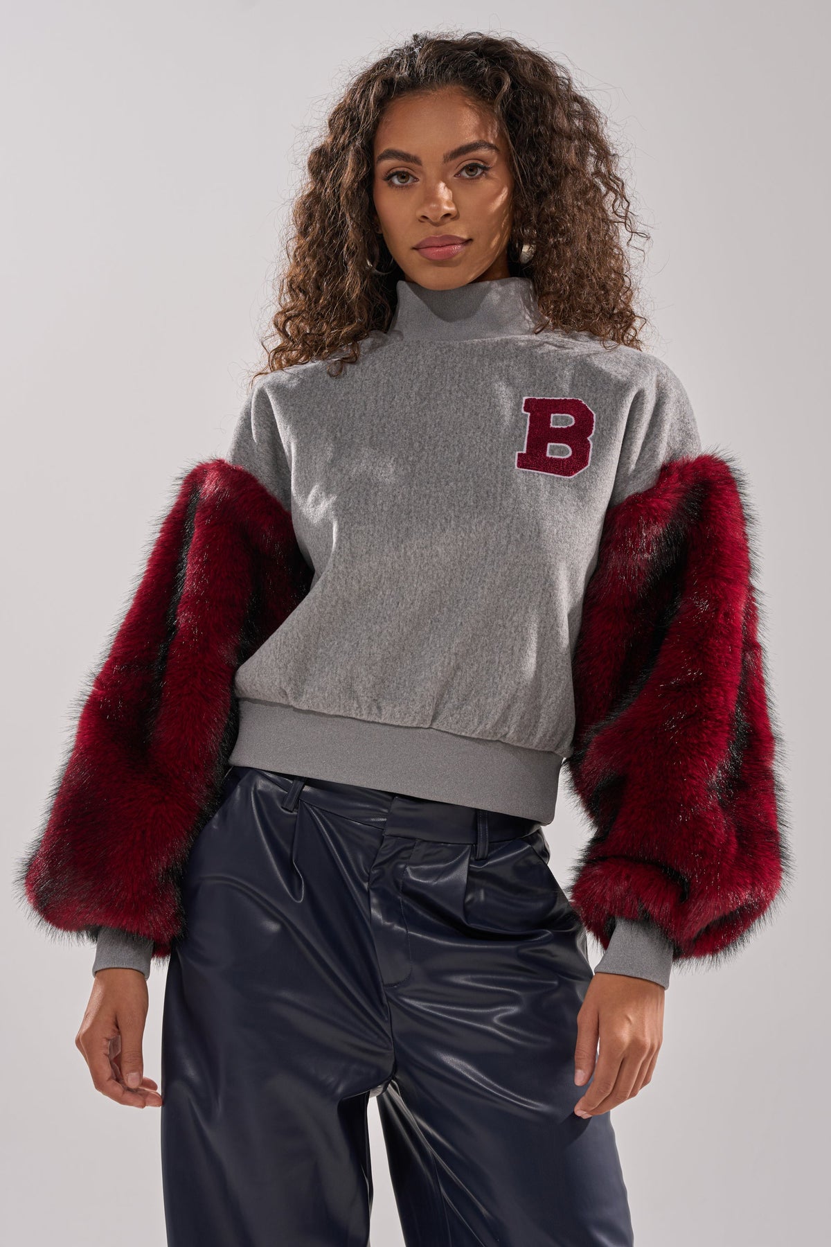 NEW EAST SIDE FAUX FUR SLEEVE SWEATSHIRT