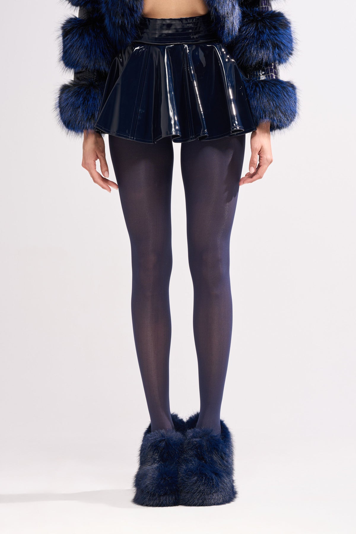 SHE IS ON FIRE FAUX LEATHER MINI SKIRT IN NAVY