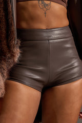 TOO HOT FAUX LEATHER MINI SHORT IN BROWN