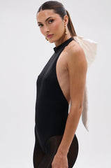 LOVE ME MORE BOW BODYSUIT
