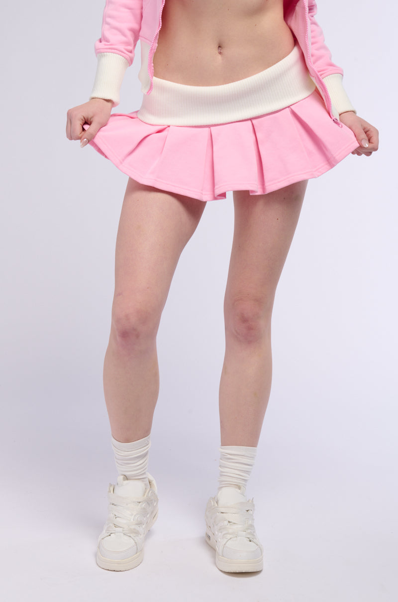 CALL ME BABY PLEATED MINI SKIRT IN PINK