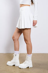 RIO PLEATED FAUX LEATHER MINI SKIRT IN WHITE