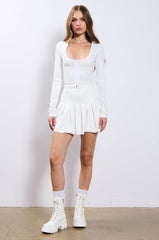 RIO PLEATED FAUX LEATHER MINI SKIRT IN WHITE